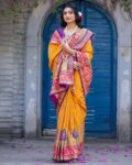 ri-wah_mustard_women_kalamkari_print_saree_with_contrast_border.jpg